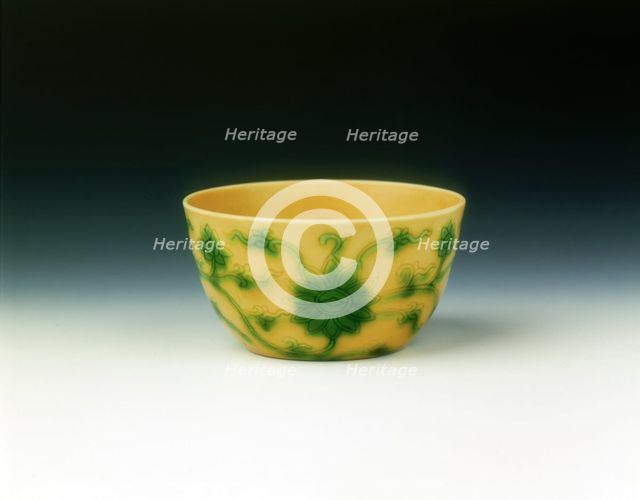 Yellow cup with lotus scrolls in green enamel, Yongzheng period, Qing dynasty, China, 1723-1735. Creator: Unknown.