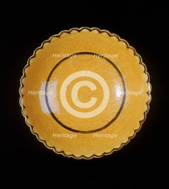 Yellow glazed dragon saucer, late Qing dynasty, China, 1870-1920. Creator: Unknown.