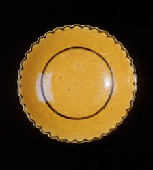 Yellow glazed dragon saucer, late Qing dynasty, China, 1870-1920. Creator: Unknown