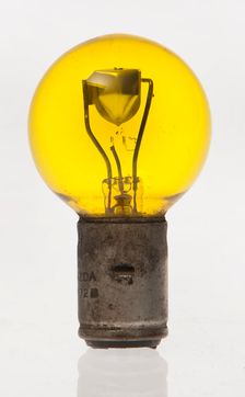 Yellow headlamp bulb. Creator: Unknown