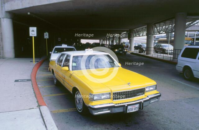 Yellow taxi cab at airport. Artist: Unknown.