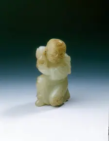 Yellowish jade kneeling tribute bearer, Tang or Liao dynasty, China, 8th-11th century. Creator: Unknown