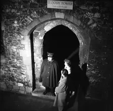 Yeoman Warder and visitors at the Bloody Tower, Tower of London, c1955. Creator: Arthur Charles Kirby Ware