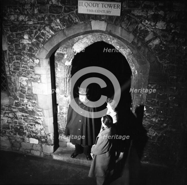 Yeoman Warder and visitors at the Bloody Tower, Tower of London, c1955. Creator: Arthur Charles Kirby Ware.
