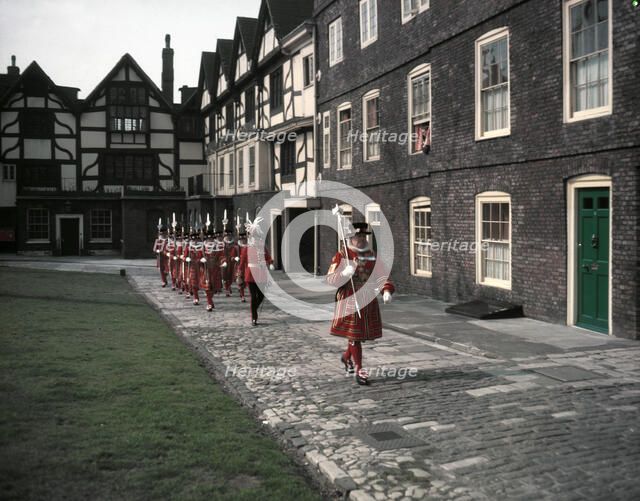 Yeomen Warders, Easter Sunday Parade led by the chief warder, Tower of London, 1954.   Creator: Arthur Charles Kirby Ware.