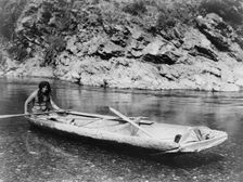 Yurok canoe on Trinity River, c1923. Creator: Edward Sheriff Curtis