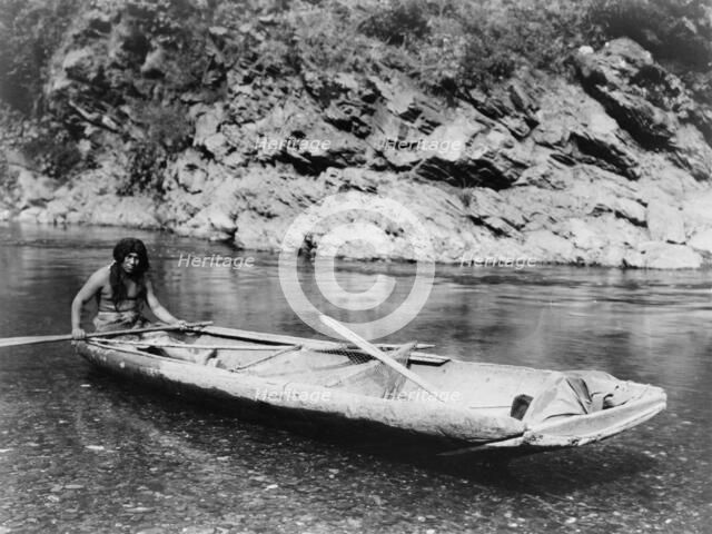 Yurok canoe on Trinity River, c1923. Creator: Edward Sheriff Curtis.