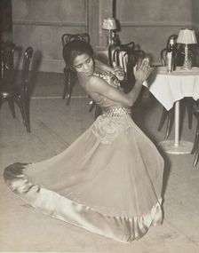 Zola King, eccentric dancer doing her nightly stunt in the cabaret scene, 1937. Creator: Unknown