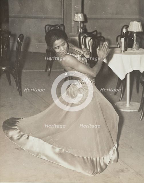 Zola King, eccentric dancer doing her nightly stunt in the cabaret scene, 1937. Creator: Unknown.