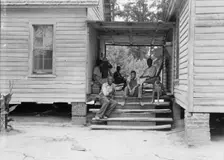 Zollie Lyons, Negro sharecropper, home from the field for dinner..., Upchurch, North Carolina, 1939. Creator: Dorothea Lange