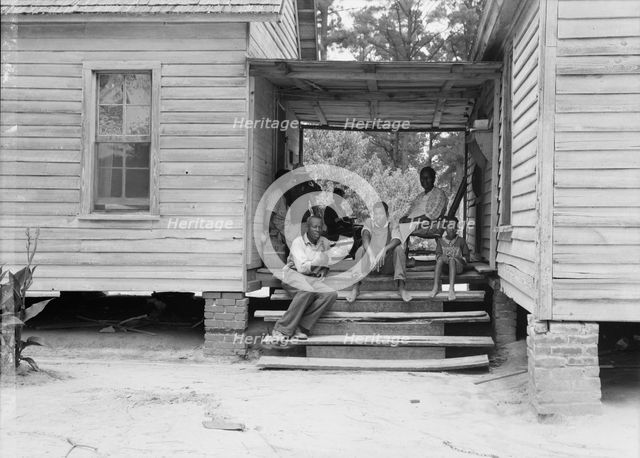 Zollie Lyons, Negro sharecropper, home from the field for dinner..., Upchurch, North Carolina, 1939. Creator: Dorothea Lange.