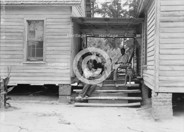 Zollie Lyons, Negro sharecropper, home from the field for dinner..., Upchurch, North Carolina, 1939. Creator: Dorothea Lange.