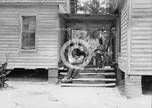 Zollie Lyons, Negro sharecropper, home from the field..., Upchurch, North Carolina, 1939. Creator: Dorothea Lange.