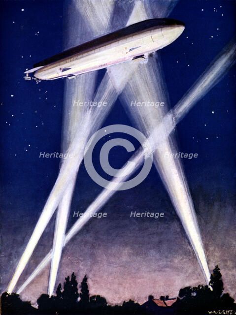 Zeppelin airship caught in searchlights during a bombing raid over England, 1916. Artist: Unknown