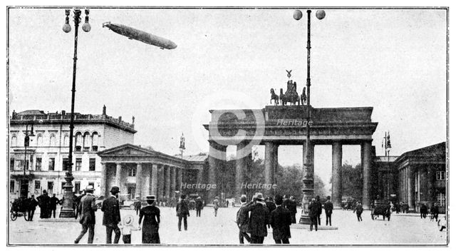 Zeppelin airship passing over Brandenburg Gate, Berlin, First World War, 1914. Artist: Unknown