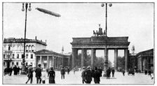 Zeppelin airship passing over Brandenburg Gate, Berlin, First World War, 1914