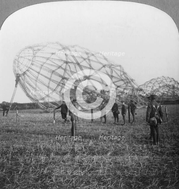 Zeppelin shot down near Colchester, Essex, World War I, 1916. Artist: Realistic Travels Publishers