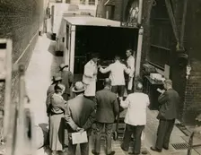 Zheng Tianxin (Dr Cheng) with vans and staff from Bishop & Sons Depositories...Burlington House,1935 Creator: Topical Press Agency