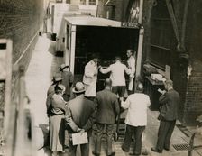 Zheng Tianxin (Dr Cheng) with vans and staff from Bishop & Sons Depositories...Burlington House,1935 Creator: Topical Press Agency