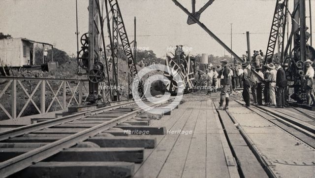 Zimbabwe: people and a flag-covered train at the opening of Victoria Bridge, 1905. Creator: J Lomas.