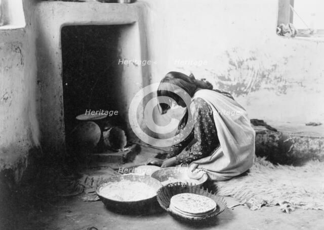 Zuni bread maker, c1903. Creator: Edward Sheriff Curtis.