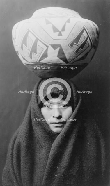 Zuni girl with jar, c1903. Creator: Edward Sheriff Curtis.